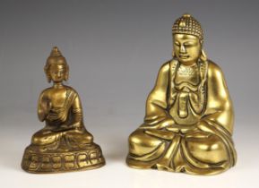 A Chinese polished bronze model of Buddha, 20th century, modelled seated with hands in
