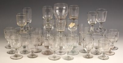 A collection of 18th century and later clear glass, wine glasses and rummers, the tallest 13cm high,