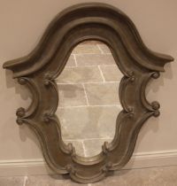 An India Jane Rococo revival wall mirror, the shaped mirrored plate within a painted and moulded 'C'