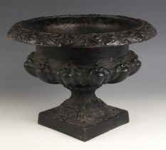 A Victorian style painted cast iron garden planter or urn, 20th century, of squat campana form on