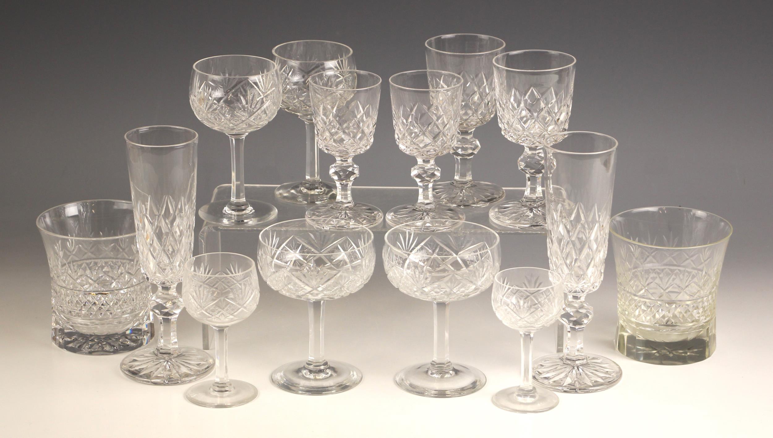 A collection of assorted glass, comprising: eight champagne flutes, 18cm high, fourteen wines, 12.