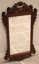A George III style mahogany and giltwood fret-work wall mirror, 20th century, with a gilt painted