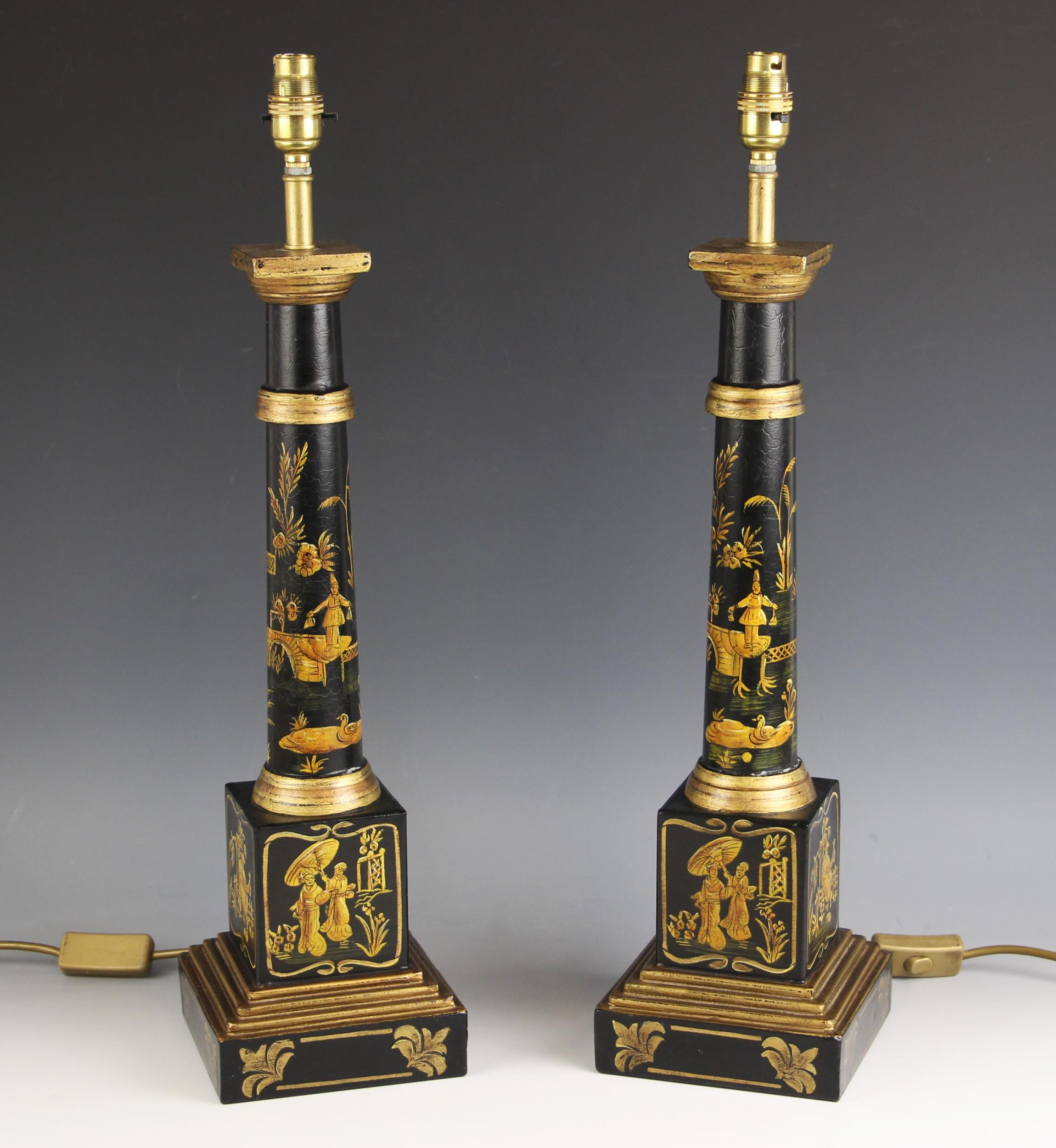 A pair of Japanned lacquered wooden table lamps, 20th century, each modelled as a tapering doric