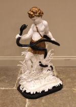 A Victorian cast iron figural stick/hall stand, modelled as Hercules wrestling a serpent upon a