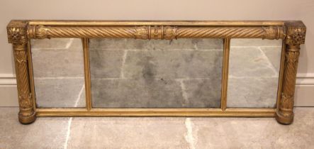 A Regency giltwood and gesso triptych overmantel mirror, the three mirrored plates enclosed by
