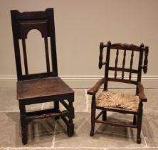 A child's ash and elm rush seat wing back kitchen chair, 19th century, with a spindled back upon