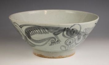 A Chinese Zhangzhou Swatow ware bowl, Ming Dynasty, the conical shaped bowl externally decorated