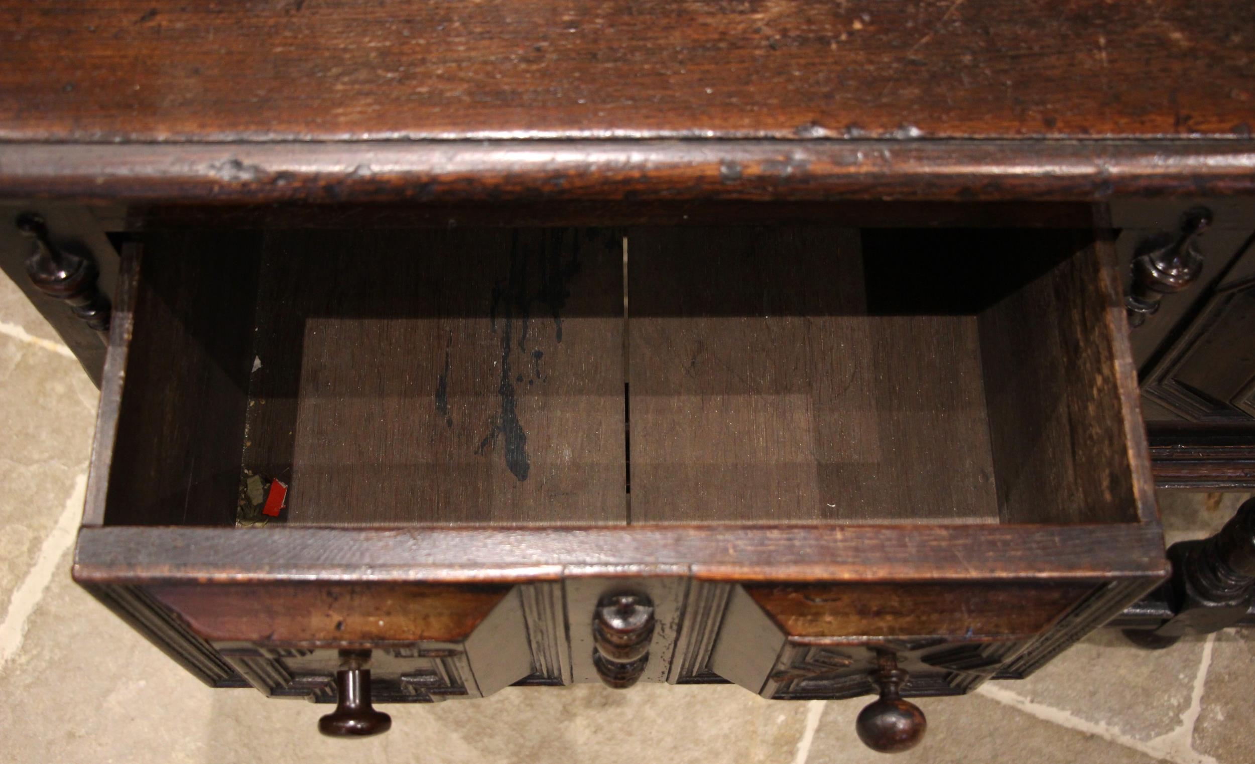 A Jacobean style oak sideboard, 17th century and later, the moulded plank top, over three frieze oak - Image 3 of 4