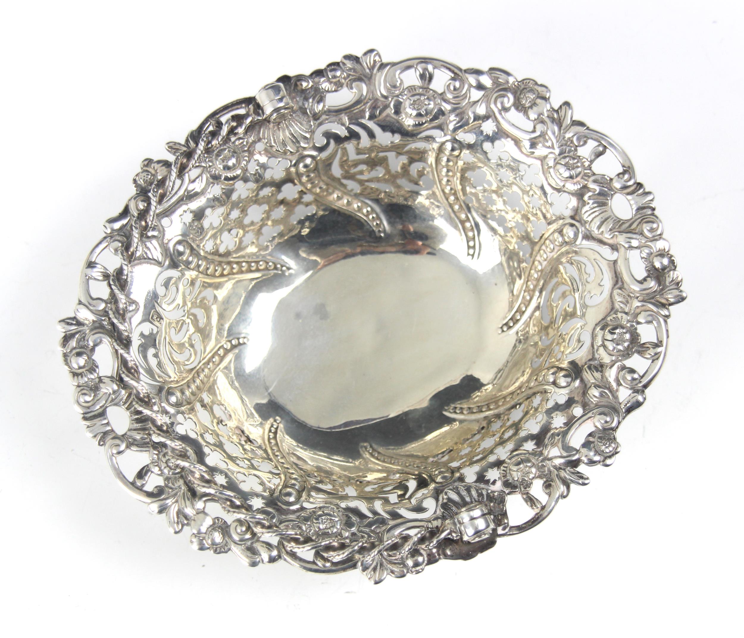 A George III silver swing handled bon bon dish, Edward Aldridge II, London 1764, the rope twist