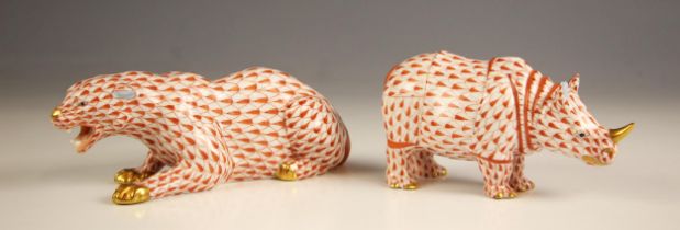 A Herend porcelain rhino, 20th century, with red fishnet decoration, gilt highlights throughout,