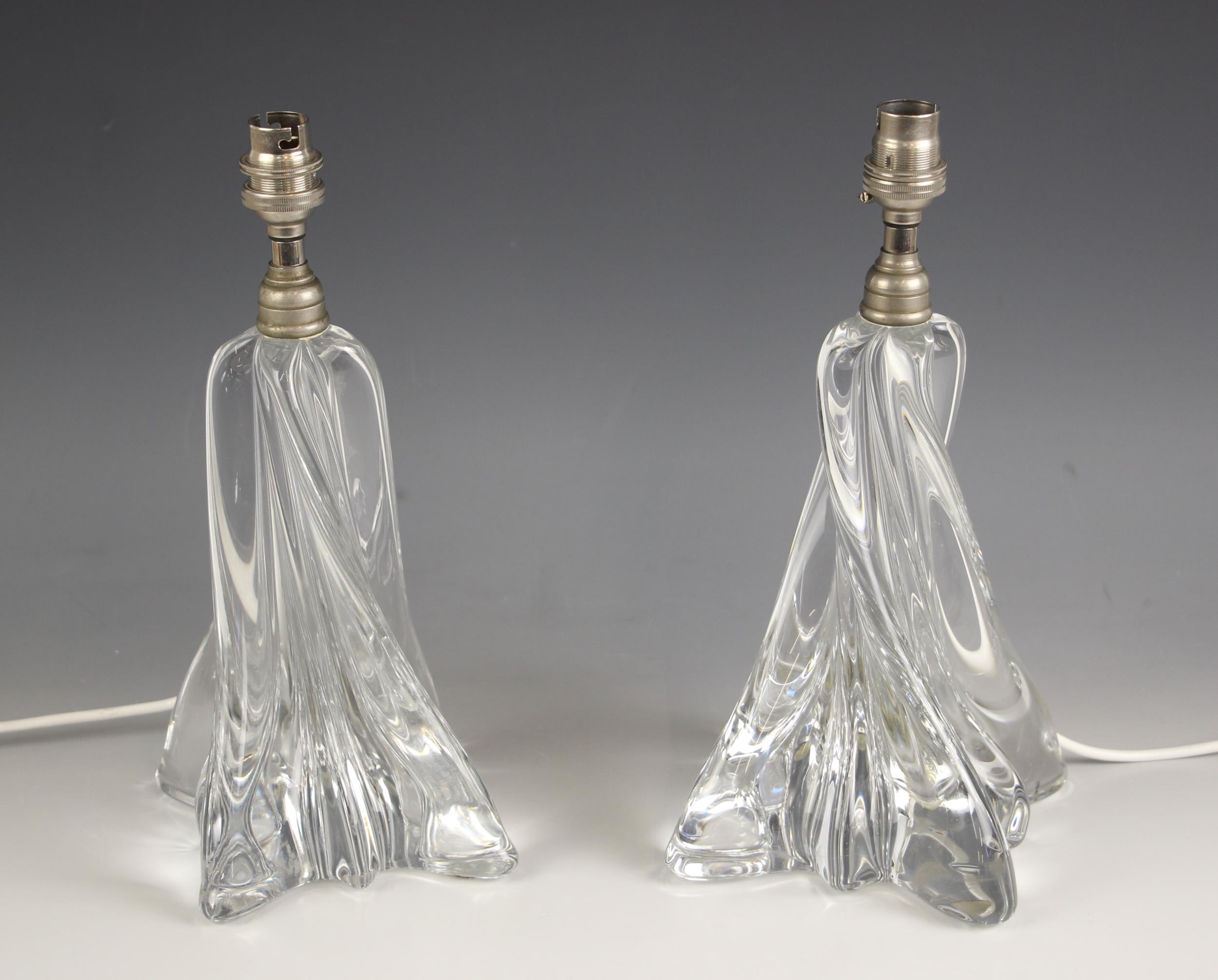 A pair of Baccarat glass table lamps, 20th century, of wrythen form, with etched maker's mark to