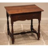 An 18th century and later oak side table, the rounded plank top over a single oak lined frieze