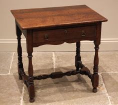 An 18th century and later oak side table, the rounded plank top over a single oak lined frieze