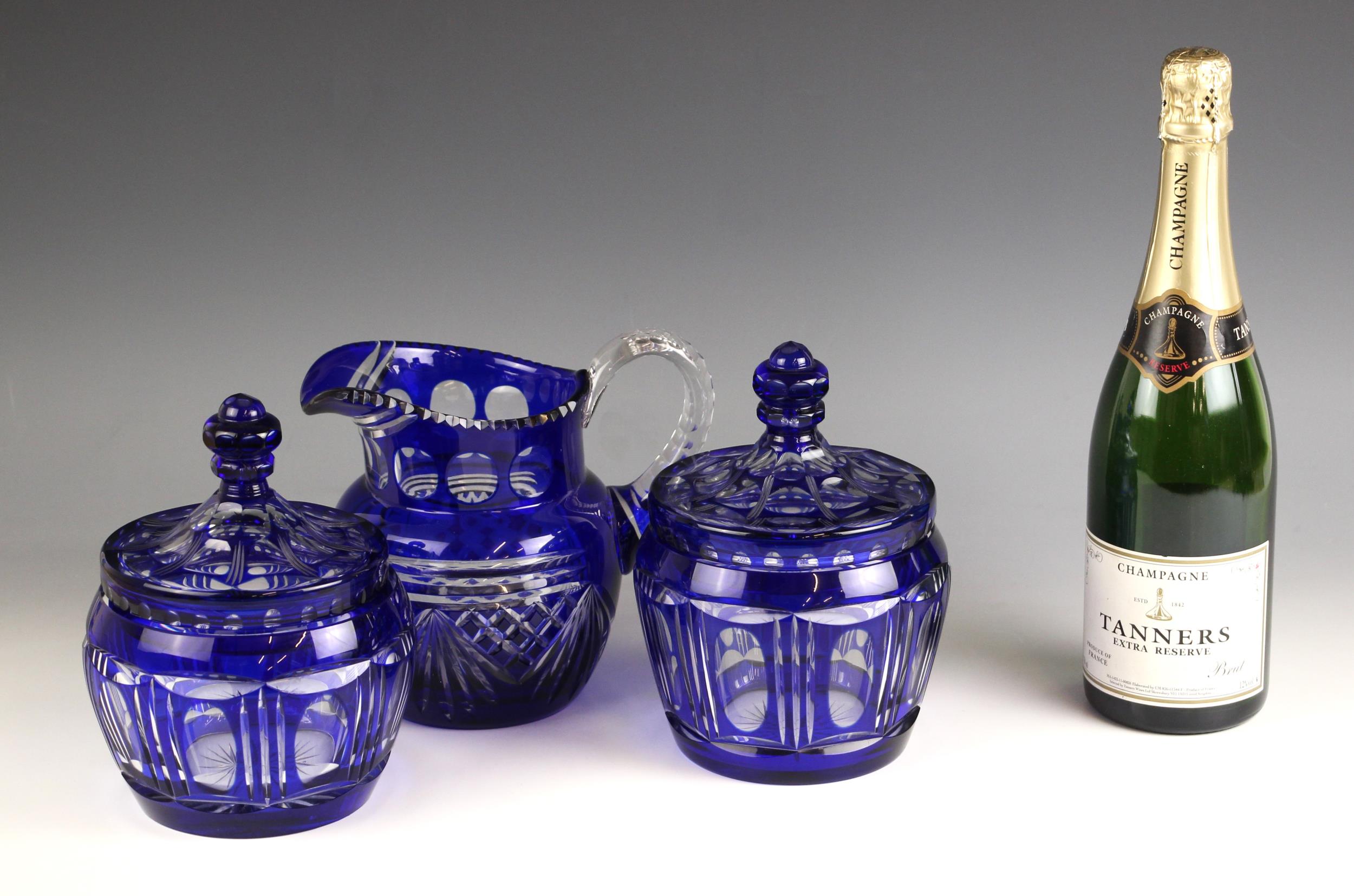 A near pair of blue flashed glass jars and covers, early 20th century, each with faceted - Image 2 of 2