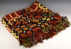 A Welsh blanket by Derw, of traditional reversible geometric design in orange, red and black,