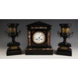 A Victorian polished slate clock garniture, comprising; a mantel clock, signed ‘R. Russell,