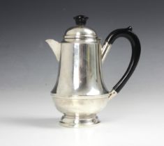 A silver hot water jug, Aaron Lufkin Dennison Birmingham 1935, of tapering cylindrical form with