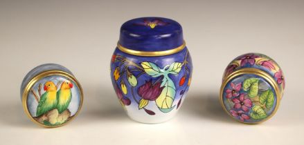 A Moorcroft enamel jar and cover of small proportions, in the 'Bittersweet' pattern, gilt banding
