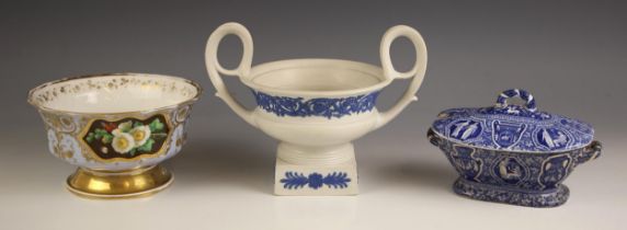 A Wedgwood two handled urn, the white ground applied with blue scrolling floral and foliate