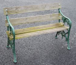 A cast-iron and hardwood slatted garden bench, the supports cast in the form of trailing ivy and