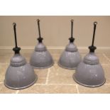 A set of four vintage Benjamin enamelled pendant industrial lamps, mid 20th century, each with a