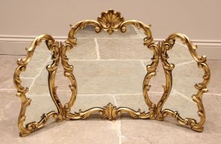 A Louis XVI style gilt composite rococo dressing table mirror, 20th century, the three mirrored