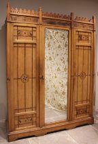 An Arts & Crafts Gothic Revival ash inlaid wardrobe, attributed to Charles Bevan, possibly