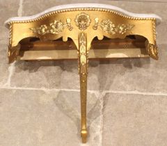 A 19th style century Italian marble topped serpentine wall bracket, later painted, the moulded and
