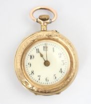 A yellow metal ladies fob watch, the circular white enamel dial with Arabic numerals, set to a