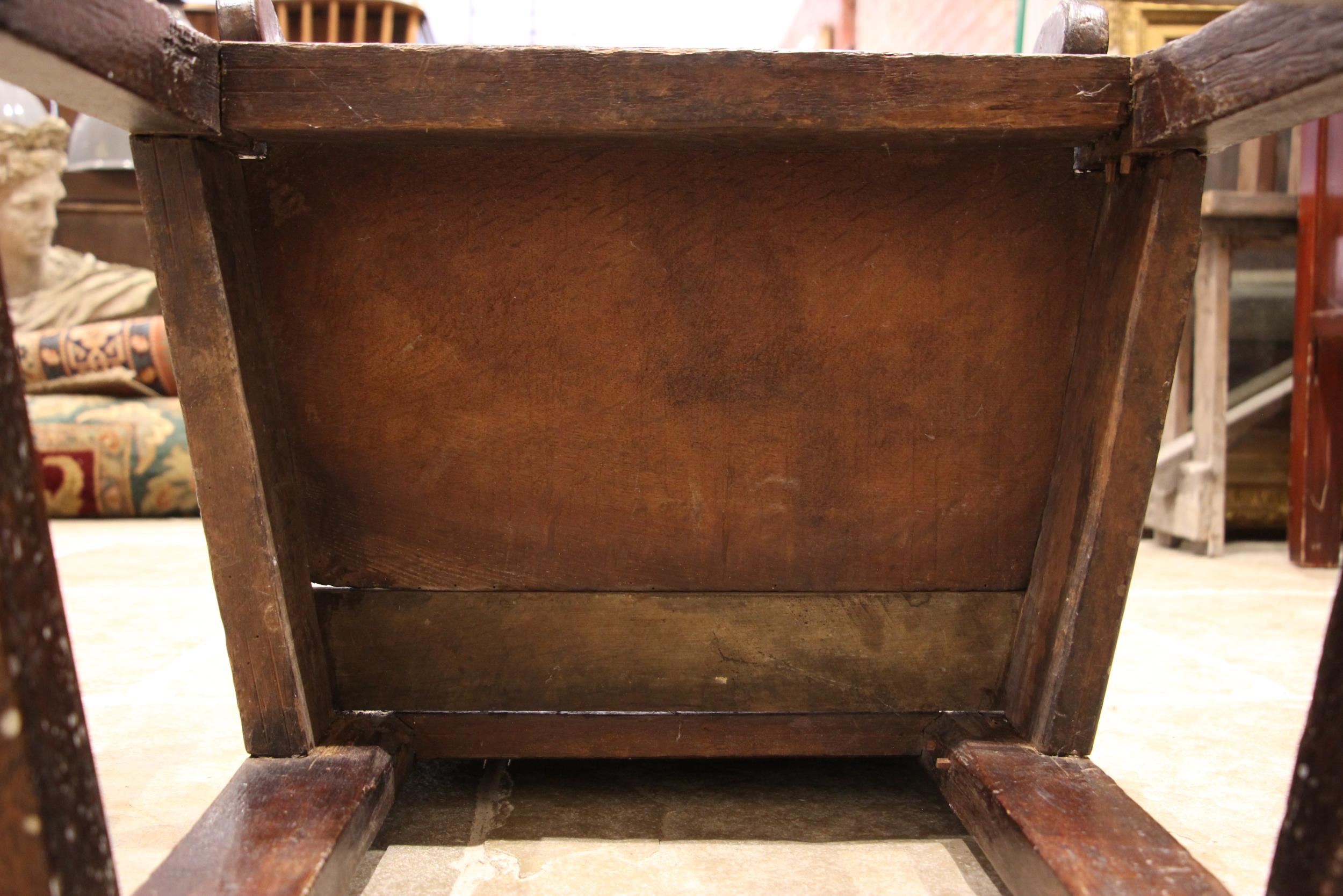 A 17th century oak Lancashire Wainscot chair, the panelled back with a shaped top rail extending - Image 4 of 8
