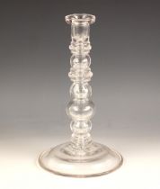 A glass lamp base, 20th century, of multi knopped form, on spreading circular foot with faux