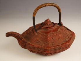 A Chinese Cinnabar lacquer octagonal teapot and cover, 18th/19th century, the squat form teapot of