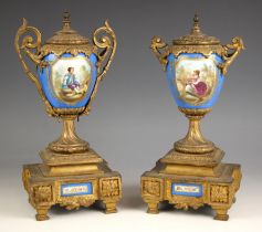 Two French Sevres style ormolu mounted porcelain urns, 19th century, each of ovoid form with