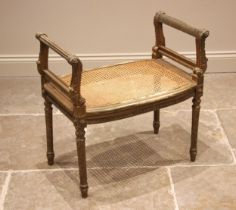 A French Louis XVI style carved giltwood dressing stool/window seat, 19th century, the side rails