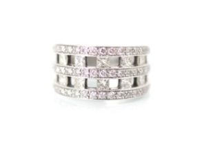 A diamond dress ring, the ten princess cut diamonds channel set within triple border of round cut