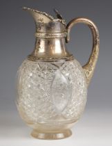 An Edwardian silver mounted claret jug, Walker and Hall, Sheffield 1905, the trefoil shaped