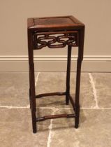 A Chinese carved hardwood jardiniere stand, the square section top above a geometric openwork