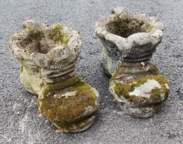 A pair of reconstituted stone planters, modelled as a pair of boots, 42cm long