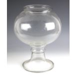 A glass leech jar, early 19th century, the compressed spherical body with flared rim, raised on an