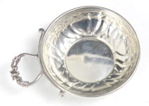 A silver tasse du vin, 'P&S' Birmingham 1993, of typical circular form with heart embossed detail to