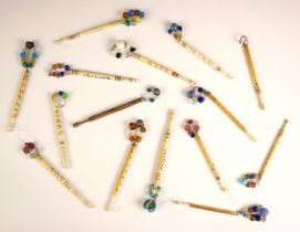 A collection of bone sweetheart lace bobbins, 19th century and later, each with carved decoration