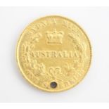 An Australia one sovereign, dated 1867, with drill hole to the top, 8gms