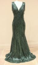 A Goddiva green sequin evening dress, the V-neck neck line leading to a fishtail train, zip