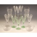 A part suite of glassware, early 20th century, each piece with banded geometric decoration to the