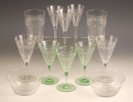 A part suite of glassware, early 20th century, each piece with banded geometric decoration to the