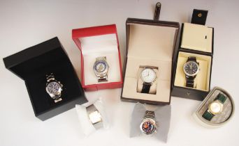 A selection of vintage boxed watches, including an Ellesse watch, upon a green leather style