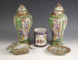 A pair of Chinese porcelain Canton vases and covers, 19th century, each of baluster form and