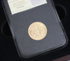 A Queen Elizabeth II full sovereign, dated 1957, within presentation box Possibly for the first mass