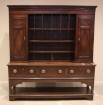 A George III and later oak and mahogany crossbanded Montgomery dresser, the high back with a moulded