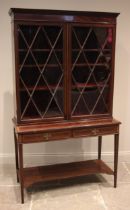 A mahogany and satinwood crossbanded display cabinet on stand, 19th century, the moulded dentil